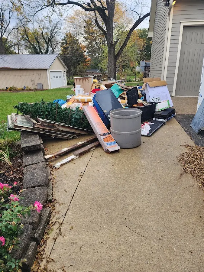 Dumpster being loaded with debris for 3 Yard Dumpster Rental in Uxbridge